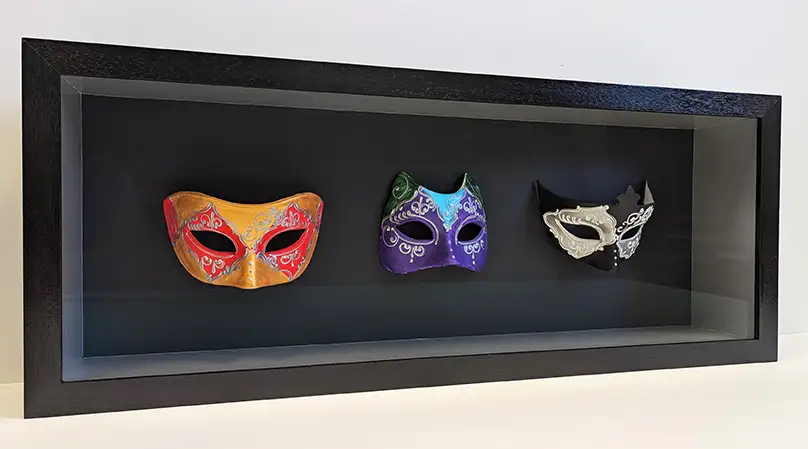 3 colourful masked framed